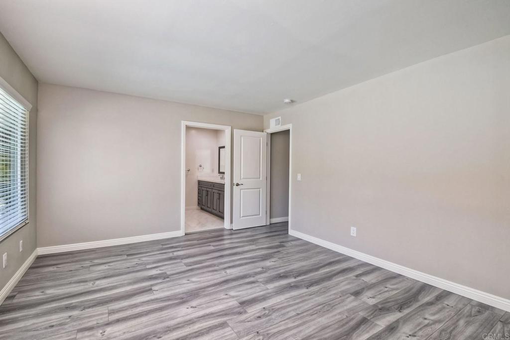 6428 El Perico Lane Carlsbad, CA 92009 - Photo 28 of 35 a view of empty room with wooden floor