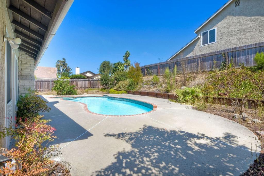 6428 El Perico Lane Carlsbad, CA 92009 - Photo 31 of 35 a view of a house with a swimming pool