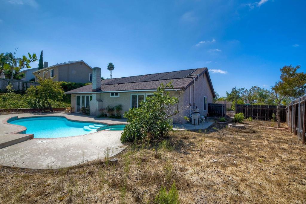 6428 El Perico Lane Carlsbad, CA 92009 - Photo 33 of 35 a view of a house with backyard and a patio