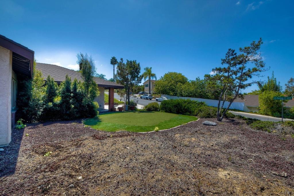 6428 El Perico Lane Carlsbad, CA 92009 - Photo 34 of 35 a view of a garden with a house in the background
