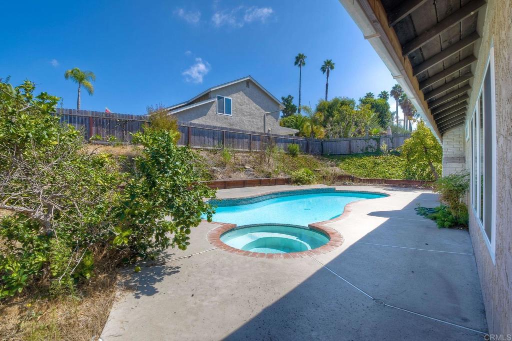 6428 El Perico Lane Carlsbad, CA 92009 - Photo 4 of 35 a front view of a house with a yard