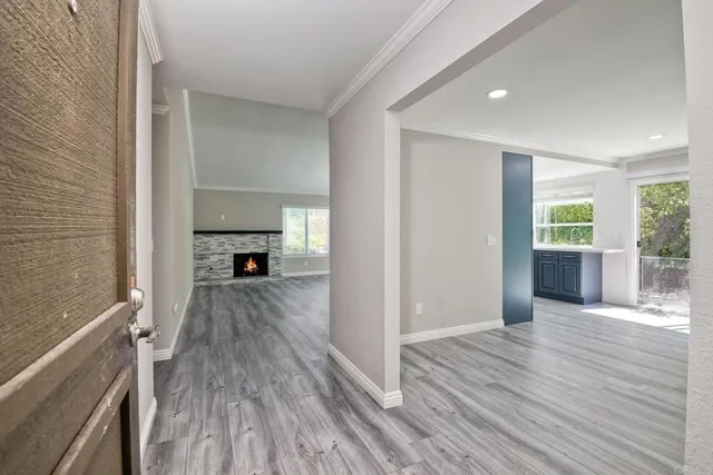 a view of hallway with wooden floor