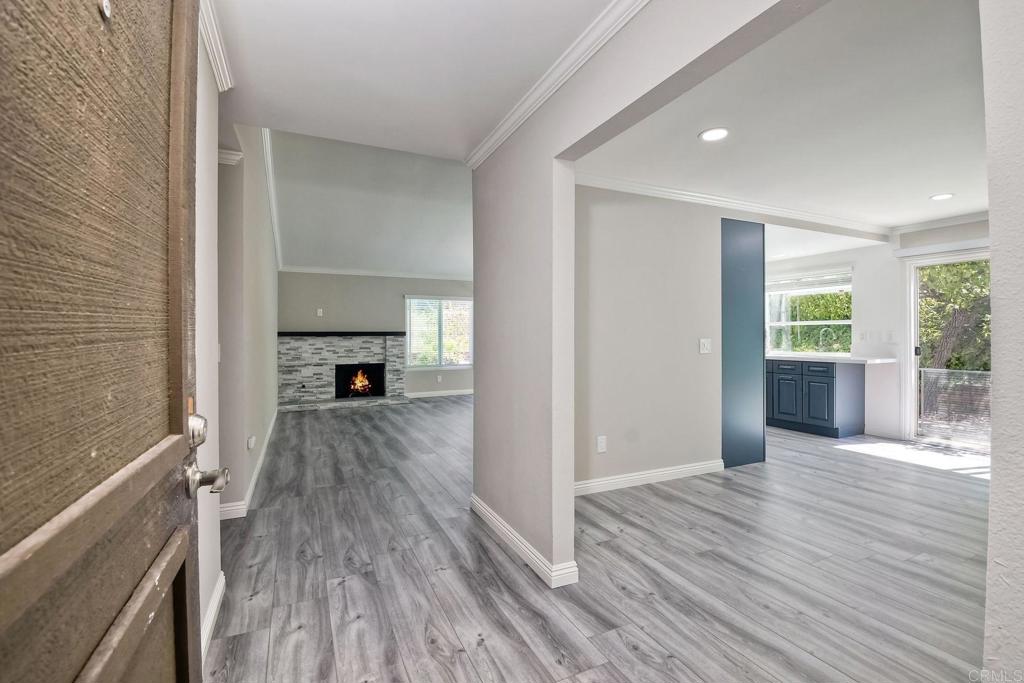 6428 El Perico Lane Carlsbad, CA 92009 - Photo 6 of 35 a view of hallway with wooden floor