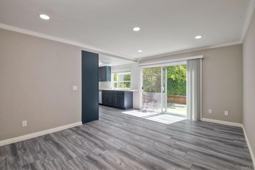 6428 El Perico Lane Carlsbad, CA 92009 - Photo 8 of 35 a view of empty room with wooden floor and fan