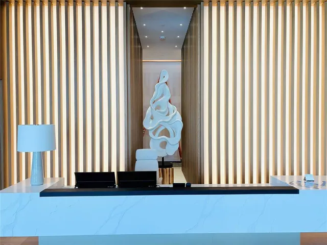 a view of living room kitchen with furniture and large window