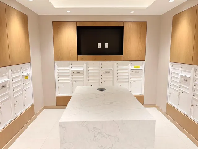 a living room with furniture and large windows