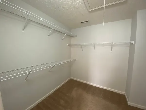 a view of a room with racks on the wall