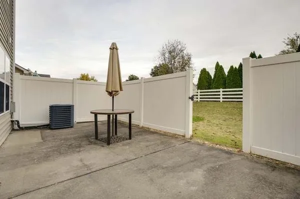 a view of a terrace with a table and chairs