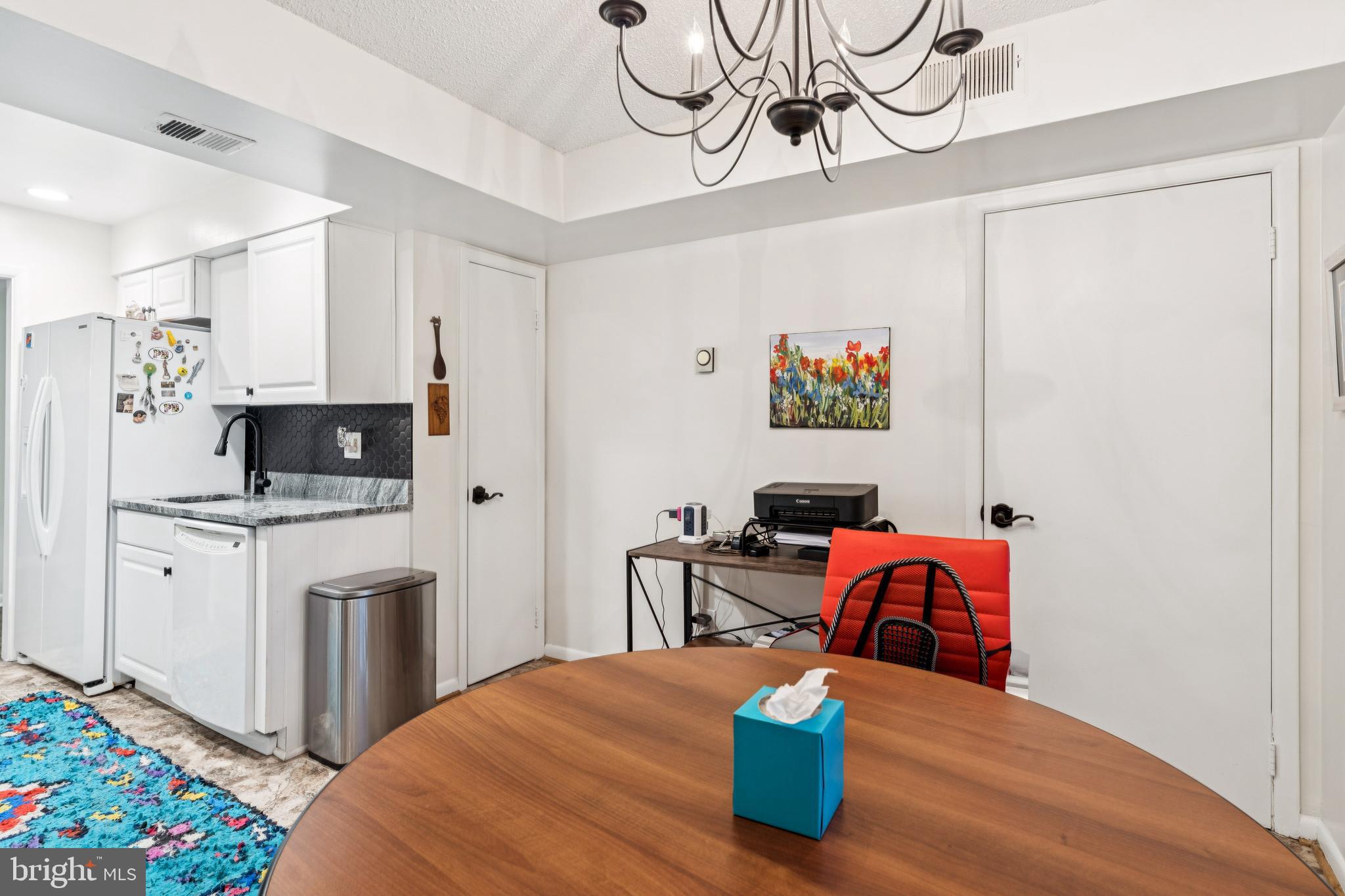 15301 Beaverbrook Court, Unit 923K Silver Spring, MD 20906 - Photo 11 of 25 a bedroom with a bed and wooden floor