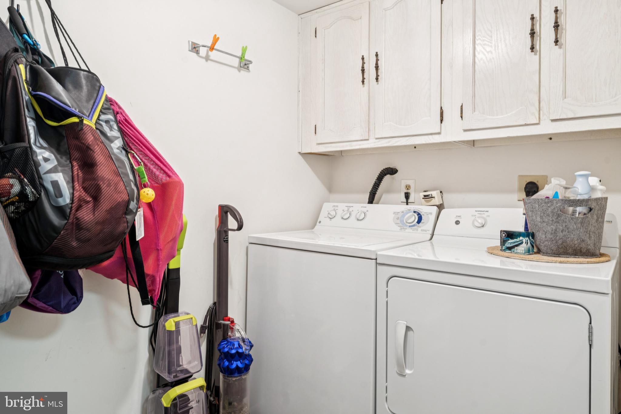 15301 Beaverbrook Court, Unit 923K Silver Spring, MD 20906 - Photo 12 of 25 a utility room with dryer and washer