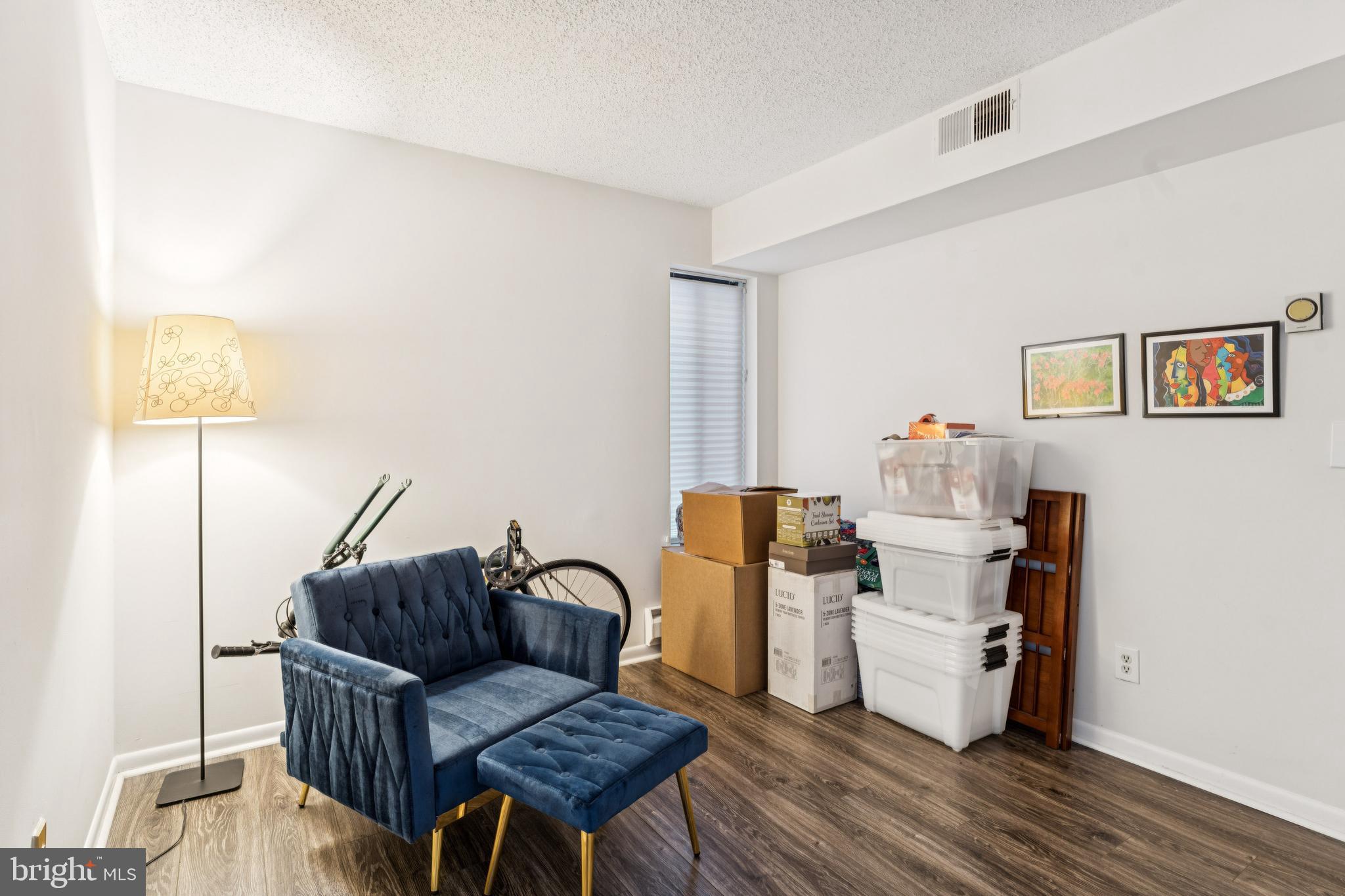 15301 Beaverbrook Court, Unit 923K Silver Spring, MD 20906 - Photo 14 of 25 a living room with furniture and a table