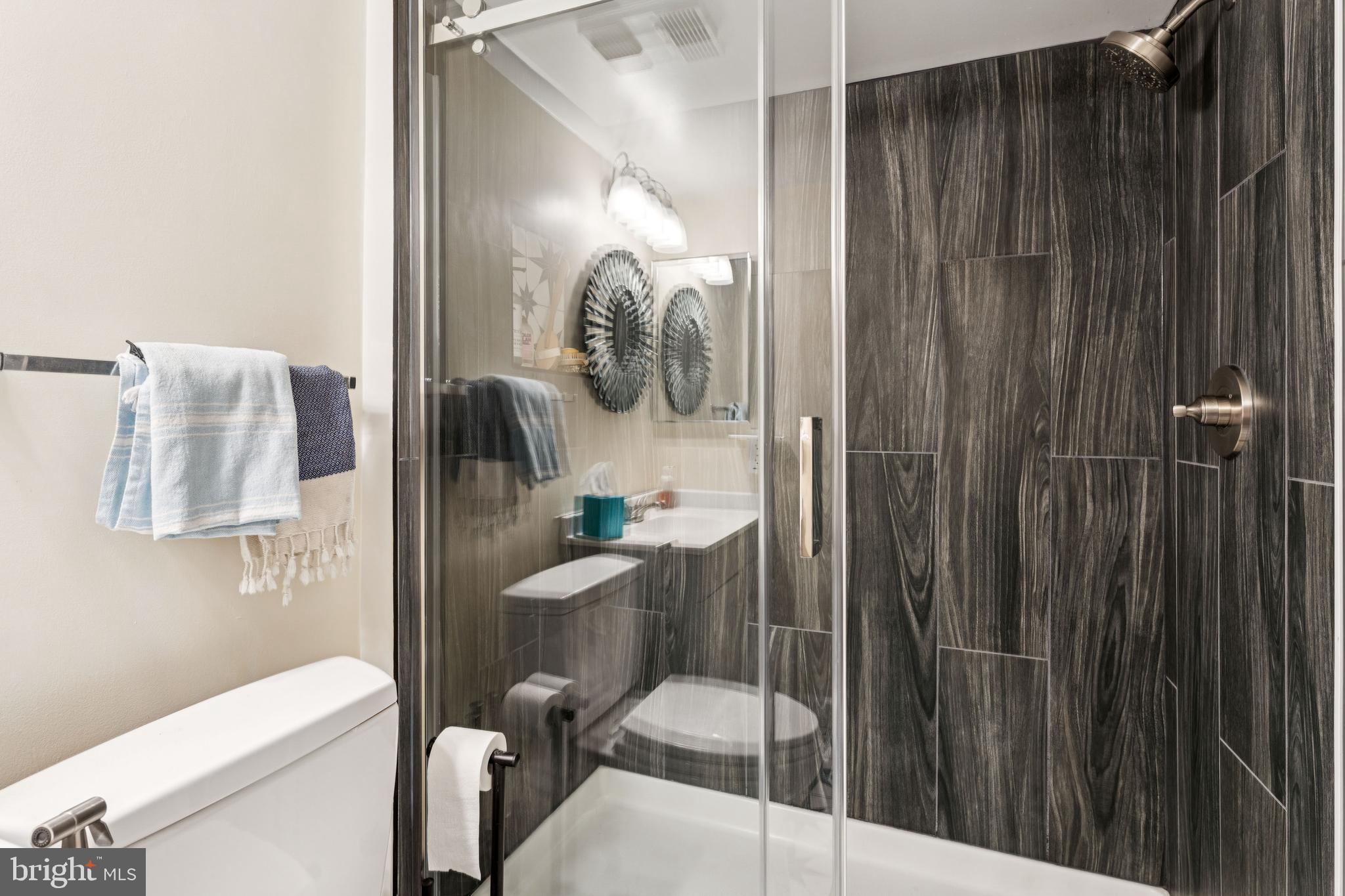 15301 Beaverbrook Court, Unit 923K Silver Spring, MD 20906 - Photo 18 of 25 a bathroom with a shower toilet and sink