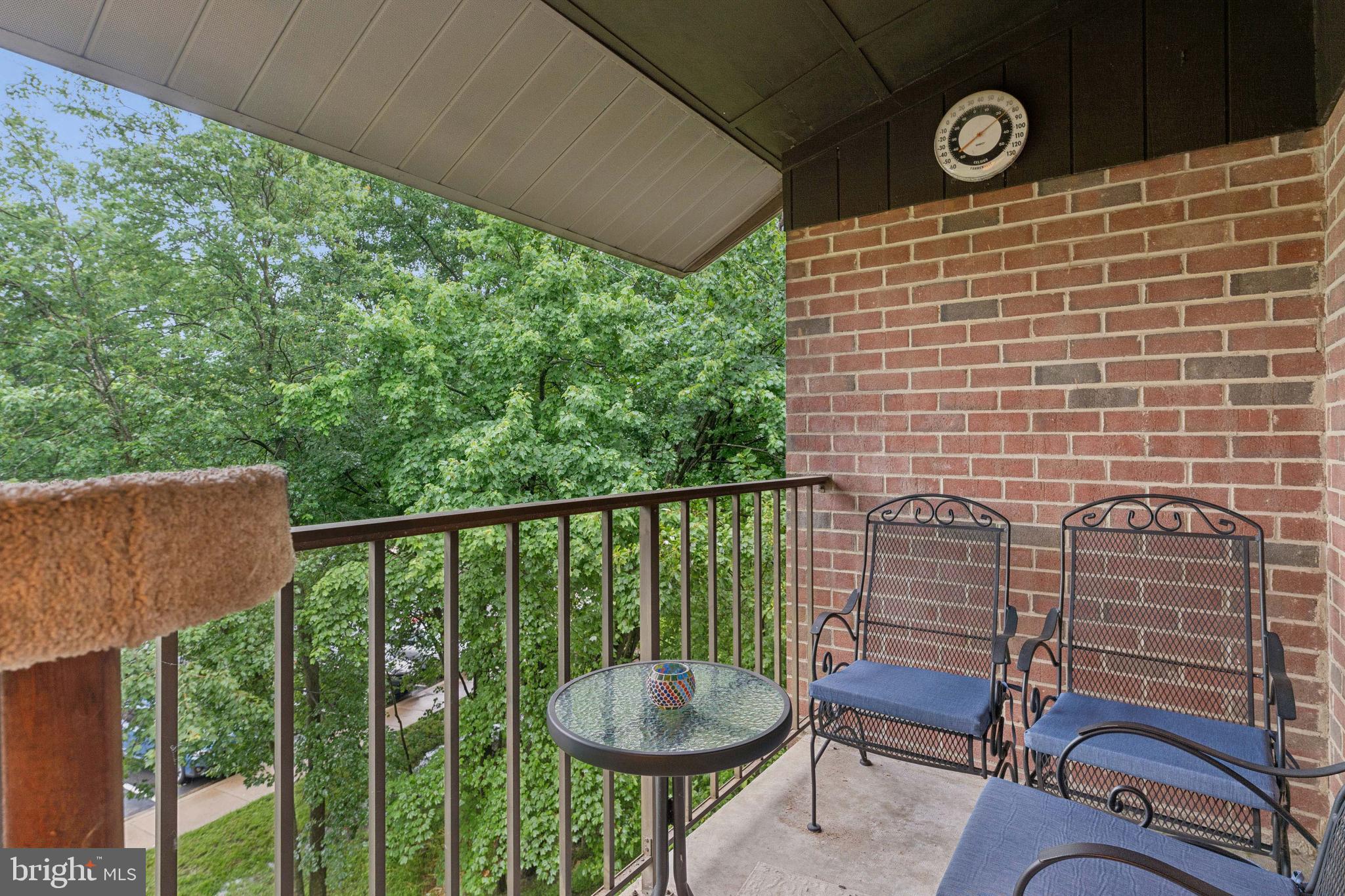 15301 Beaverbrook Court, Unit 923K Silver Spring, MD 20906 - Photo 21 of 25 a view of a chair and table in the balcony