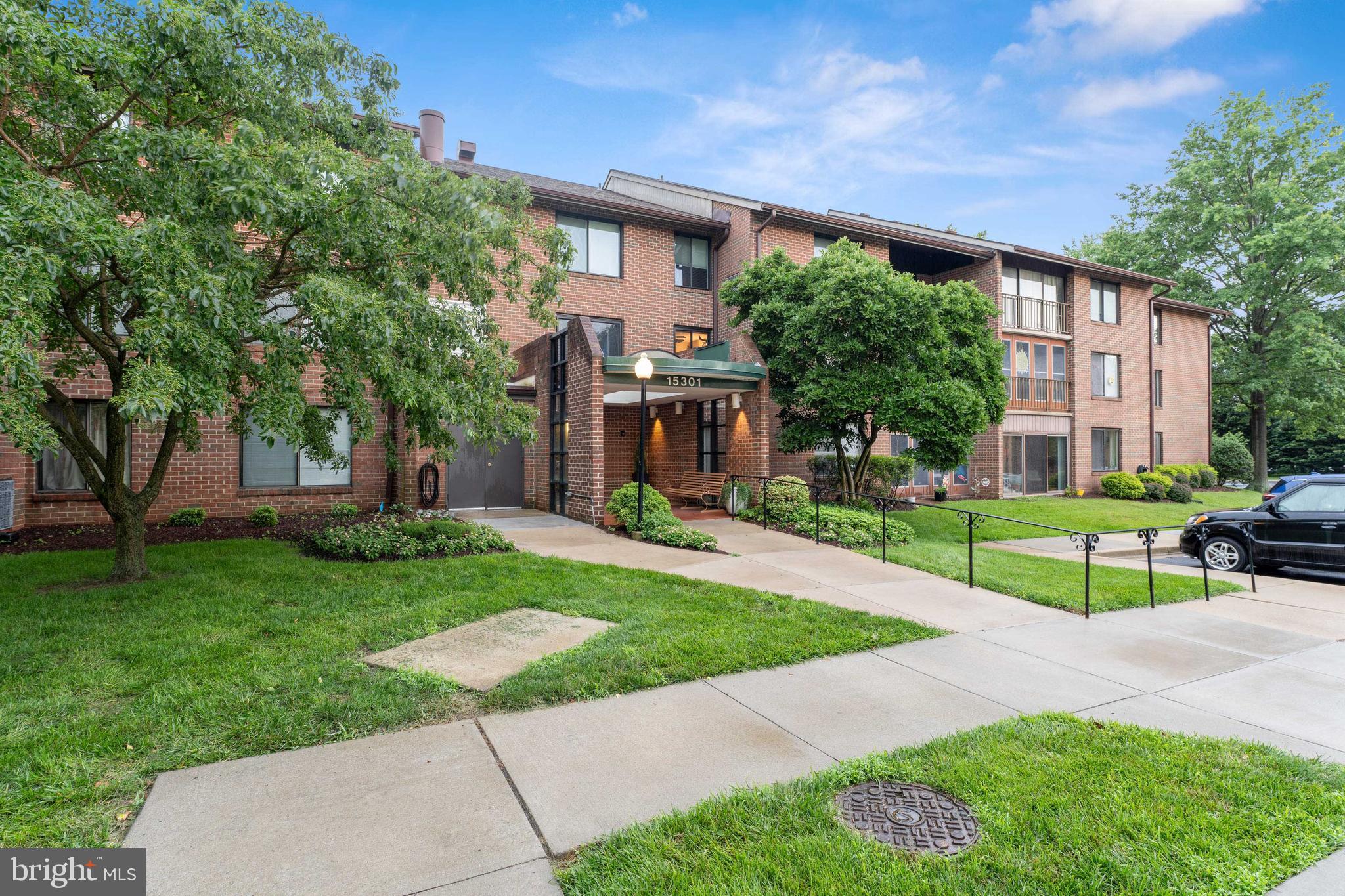15301 Beaverbrook Court, Unit 923K Silver Spring, MD 20906 - Photo 23 of 25 a view of a house with a yard