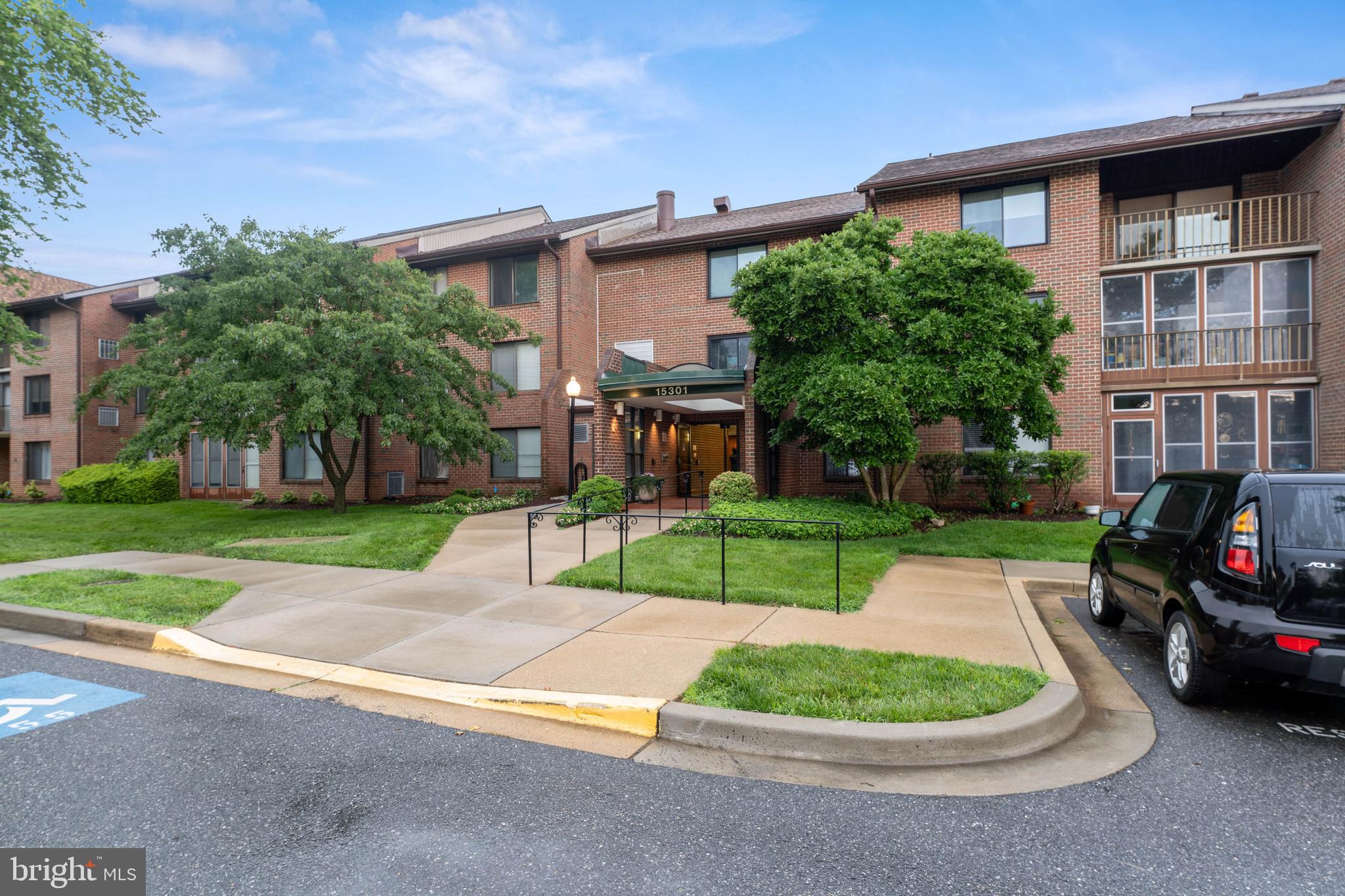 15301 Beaverbrook Court, Unit 923K Silver Spring, MD 20906 - Photo 24 of 25 front view of a house with a yard