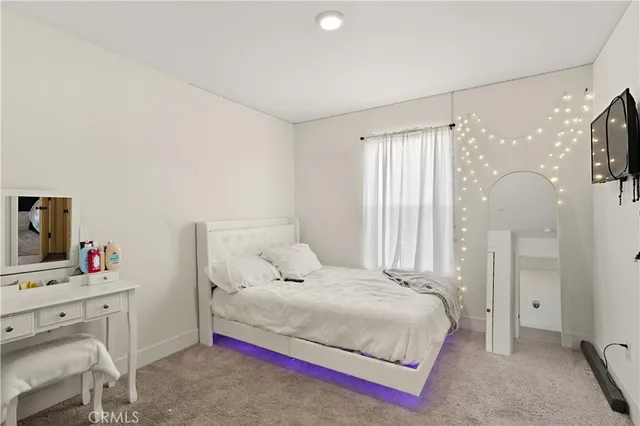 a bedroom with a bed and a cabinets