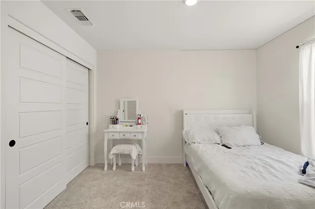 a bathroom with a double vanity sink a mirror and shower