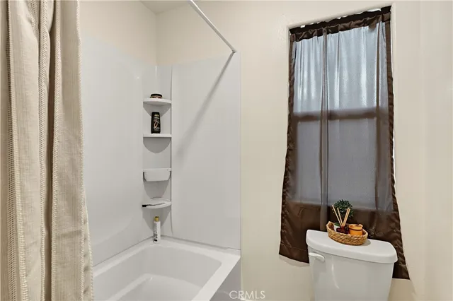 a bathroom with a double vanity sink a mirror and shower