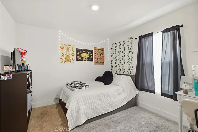a view of a house with wooden fence