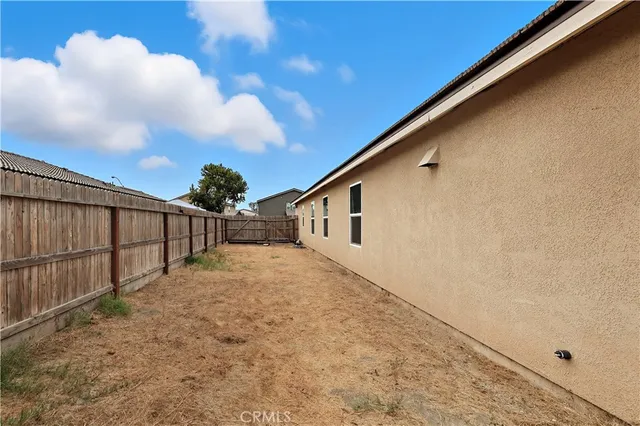 a view of a swimming pool with a lounge chair and floor to ceiling window