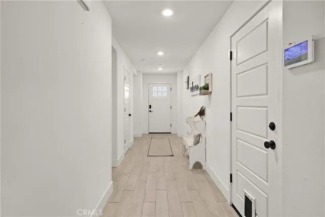 a view of entryway with white doors