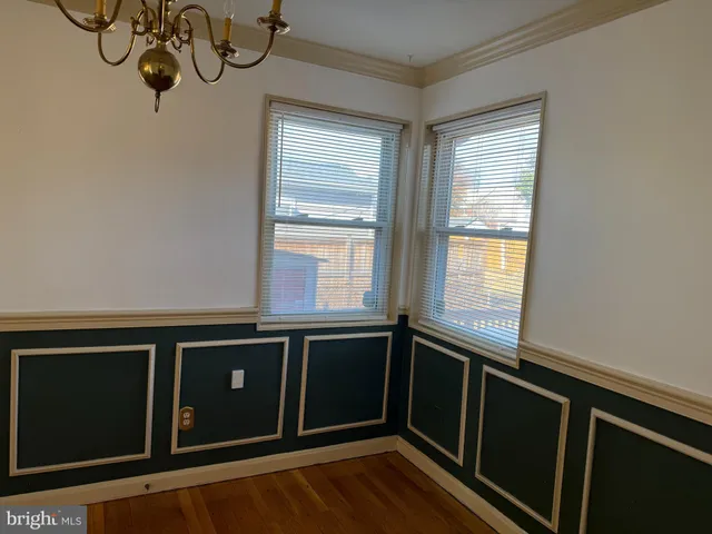 a view of a kitchen with a sink and windows