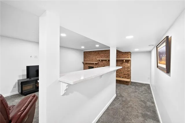 a view of a backyard with swimming pool