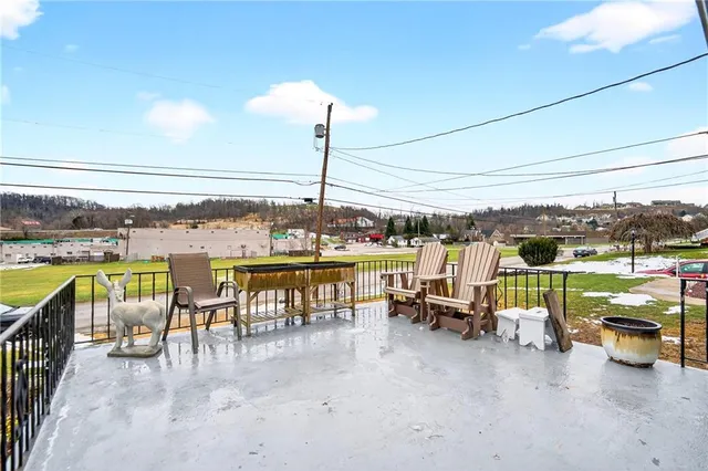 a view of a swimming pool with furniture