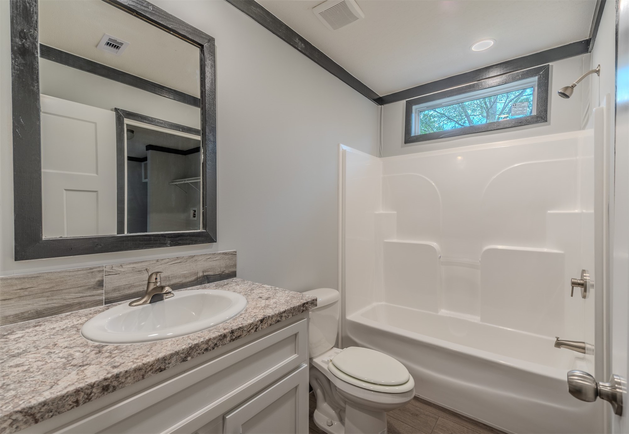 541746 Lem Turner Road Callahan, FL 32011 - Photo 20 of 25 a bathroom with a granite countertop sink toilet and shower