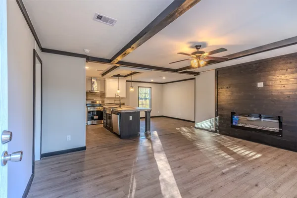 a view of a living room and a kitchen