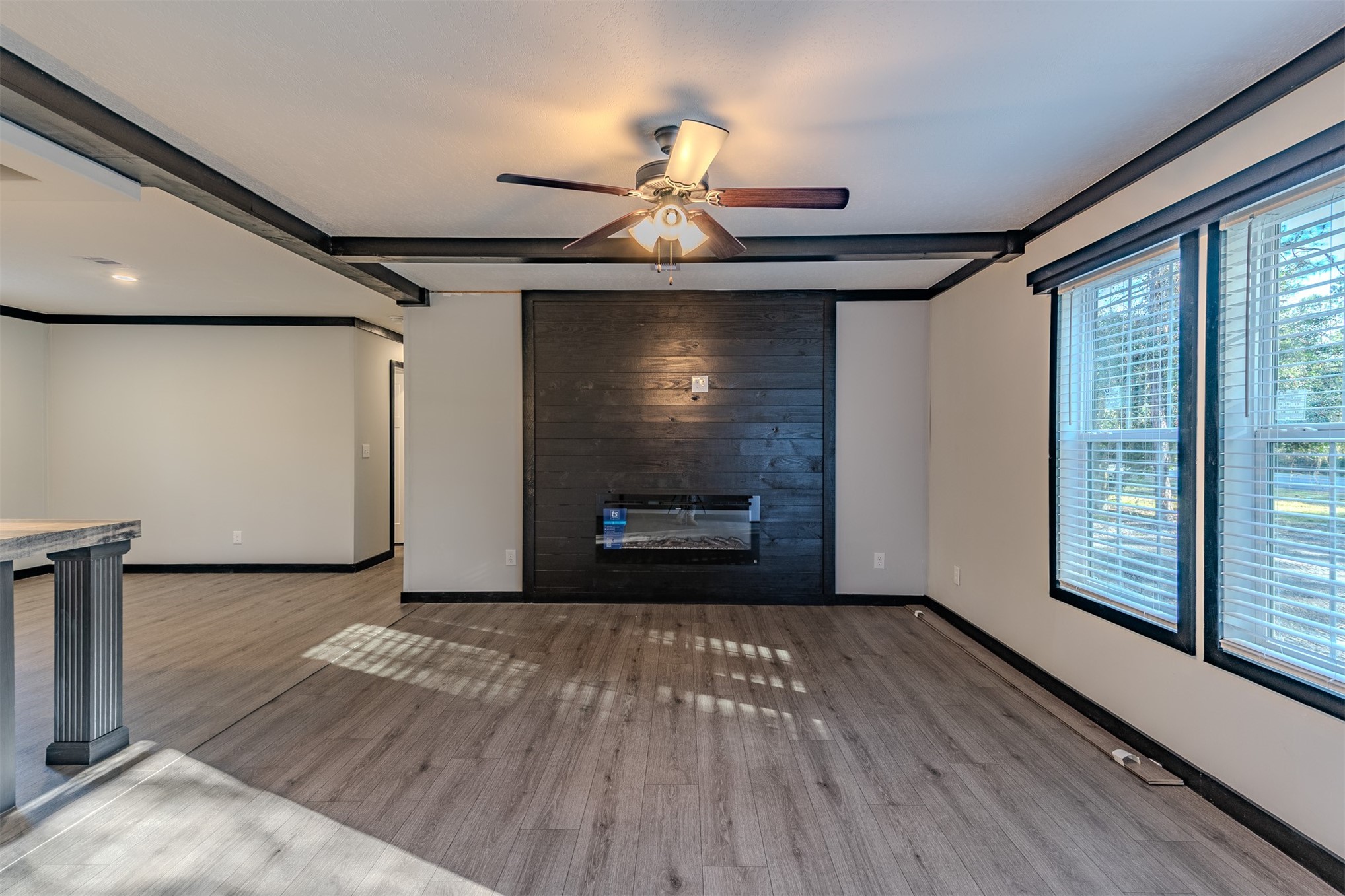 541746 Lem Turner Road Callahan, FL 32011 - Photo 5 of 25 a view of wooden floor fire place and windows in a room