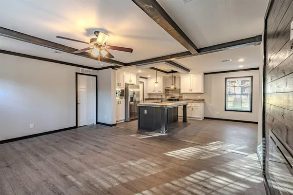 a view of a kitchen with a sink cabinets and window