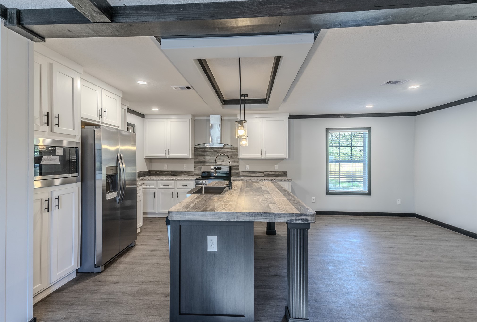 541746 Lem Turner Road Callahan, FL 32011 - Photo 7 of 25 a kitchen with stainless steel appliances granite countertop a refrigerator a sink a stove and oven