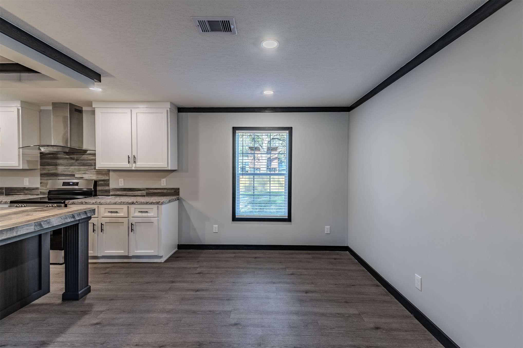 541746 Lem Turner Road Callahan, FL 32011 - Photo 10 of 25 a view of a kitchen with a sink dishwasher and wooden floor