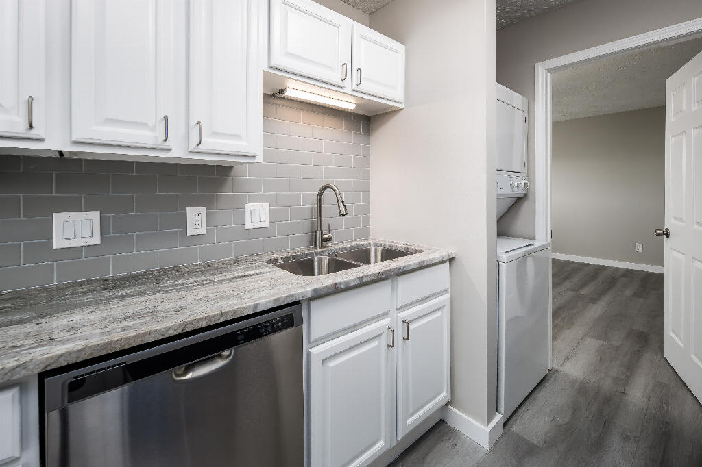 64 Cross Creek Road, Unit 20 Miramar Beach, FL 32550 - Photo 12 of 19 a kitchen with stainless steel appliances granite countertop a sink dishwasher a refrigerator and cabinets