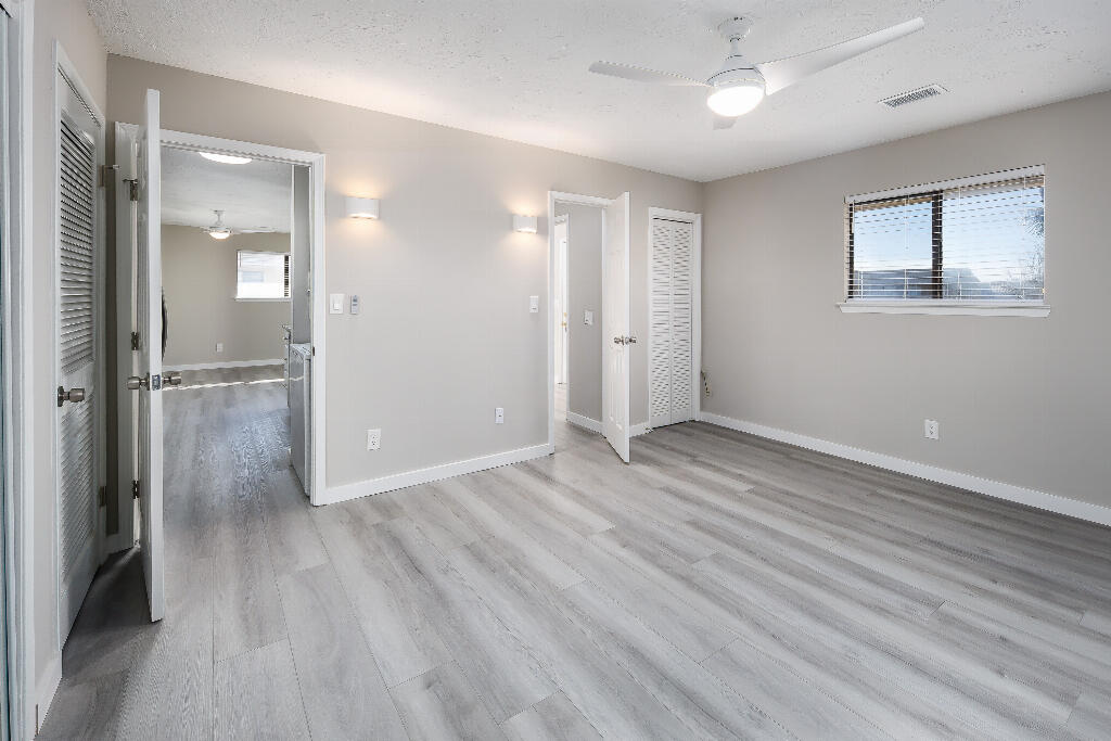 64 Cross Creek Road, Unit 20 Miramar Beach, FL 32550 - Photo 14 of 19 wooden floor in an empty room with a window