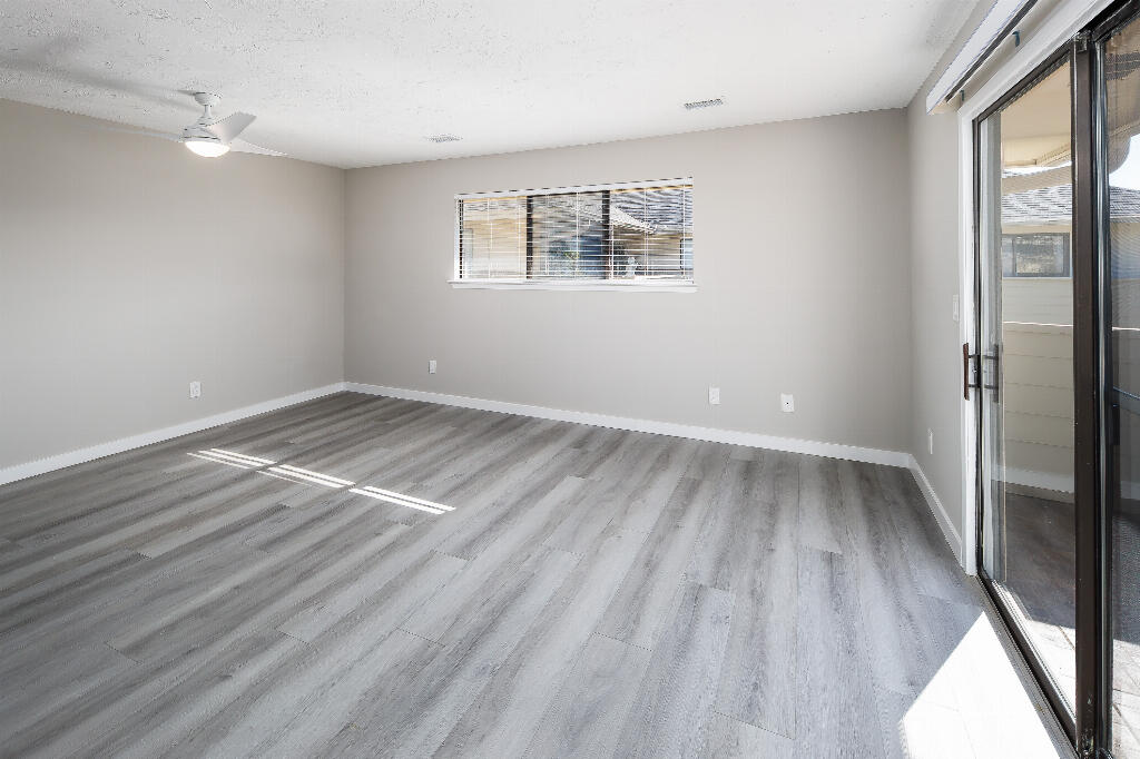 64 Cross Creek Road, Unit 20 Miramar Beach, FL 32550 - Photo 9 of 19 wooden floor in an empty room with a window