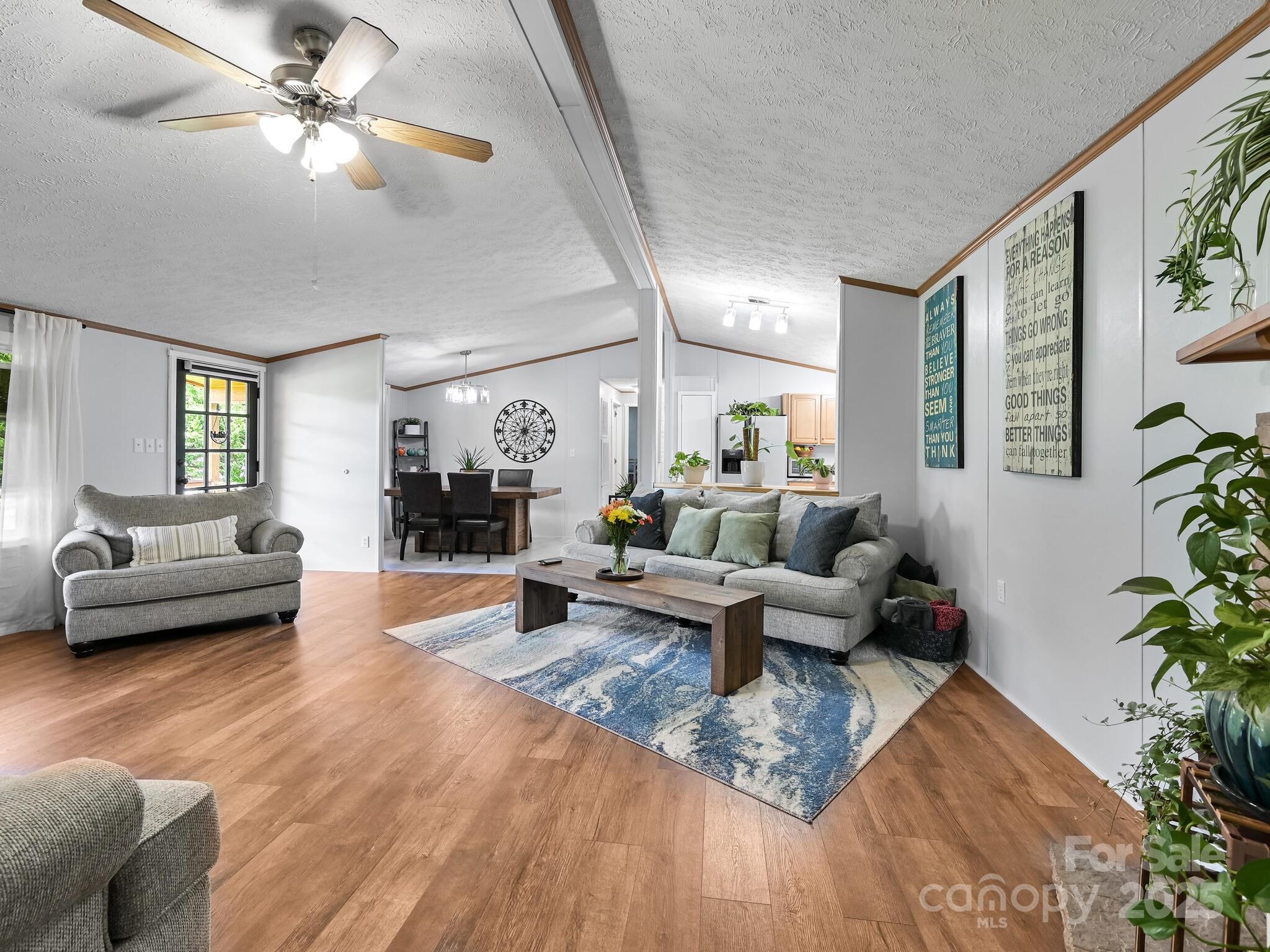 450 Berry Wills Road Hot Springs, NC 28743 - Photo 19 of 48 a living room with furniture and a large window