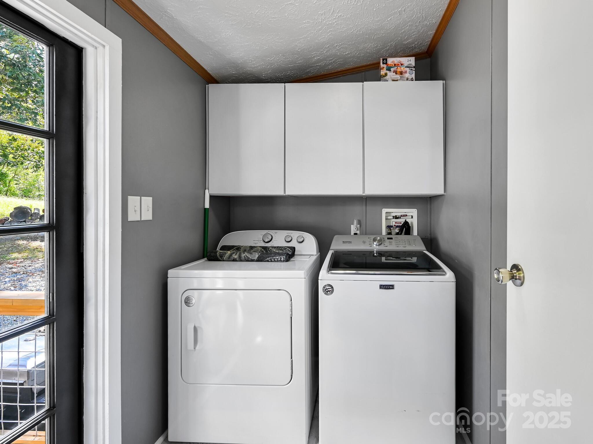450 Berry Wills Road Hot Springs, NC 28743 - Photo 28 of 48 a view of storage and utility room with washer and dryer