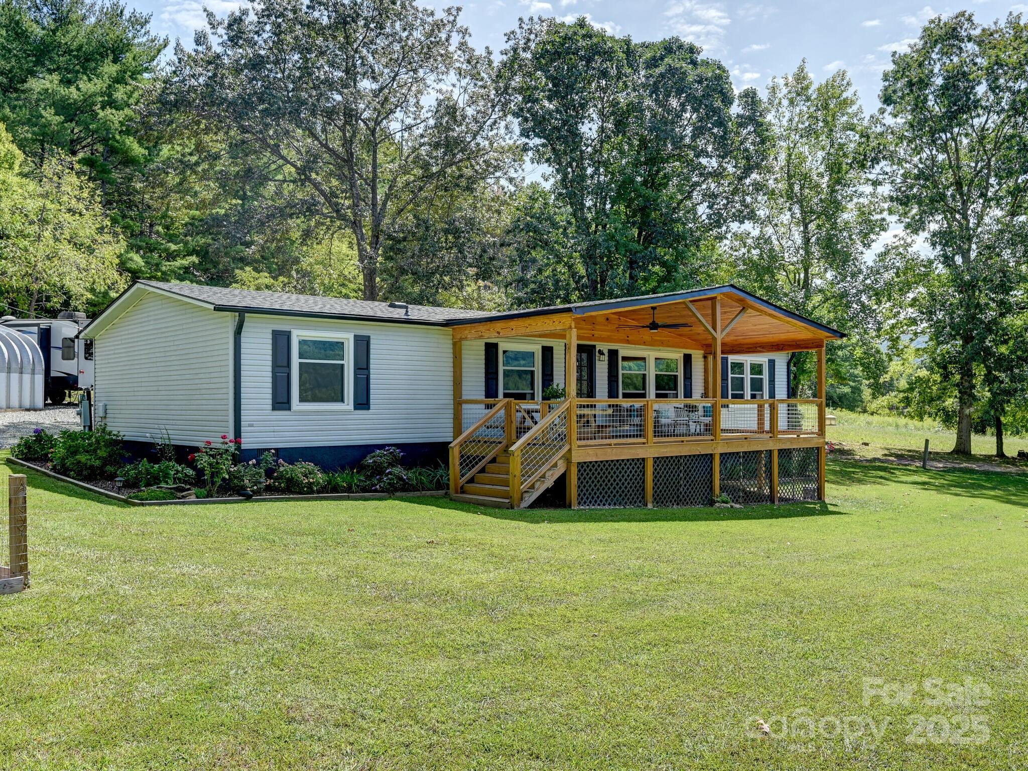 450 Berry Wills Road Hot Springs, NC 28743 - Photo 29 of 48 a view of a house with a yard