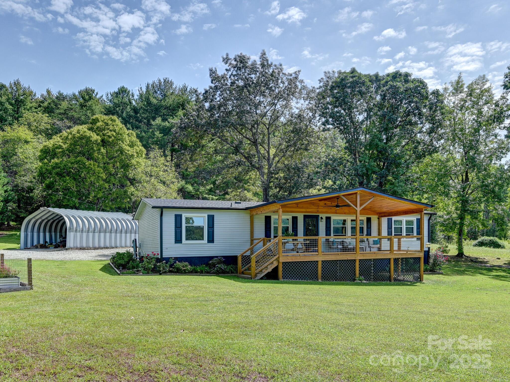 450 Berry Wills Road Hot Springs, NC 28743 - Photo 30 of 48 a house with swimming pool in front of it