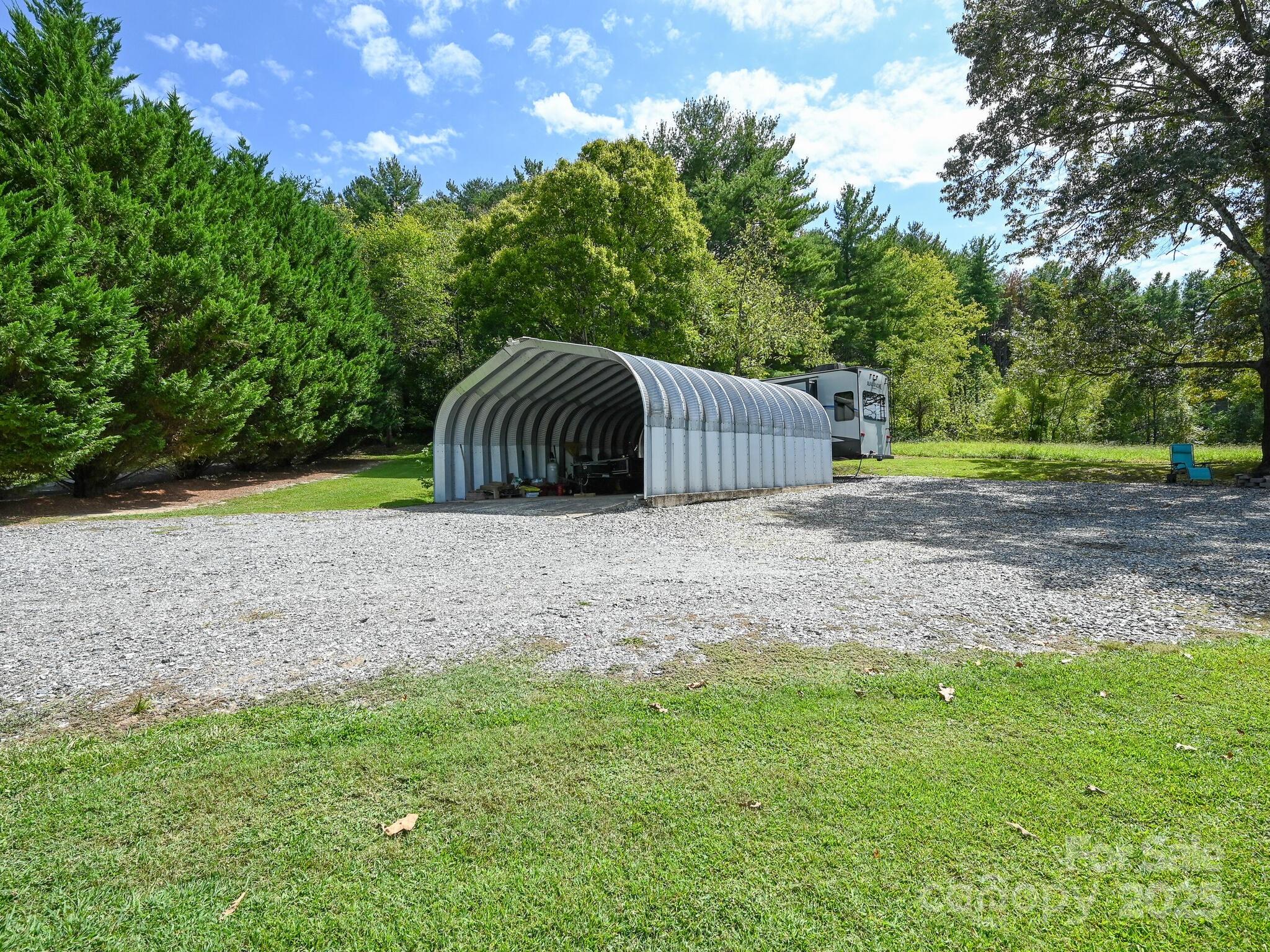 450 Berry Wills Road Hot Springs, NC 28743 - Photo 46 of 48 a view of a wooden deck and a yard