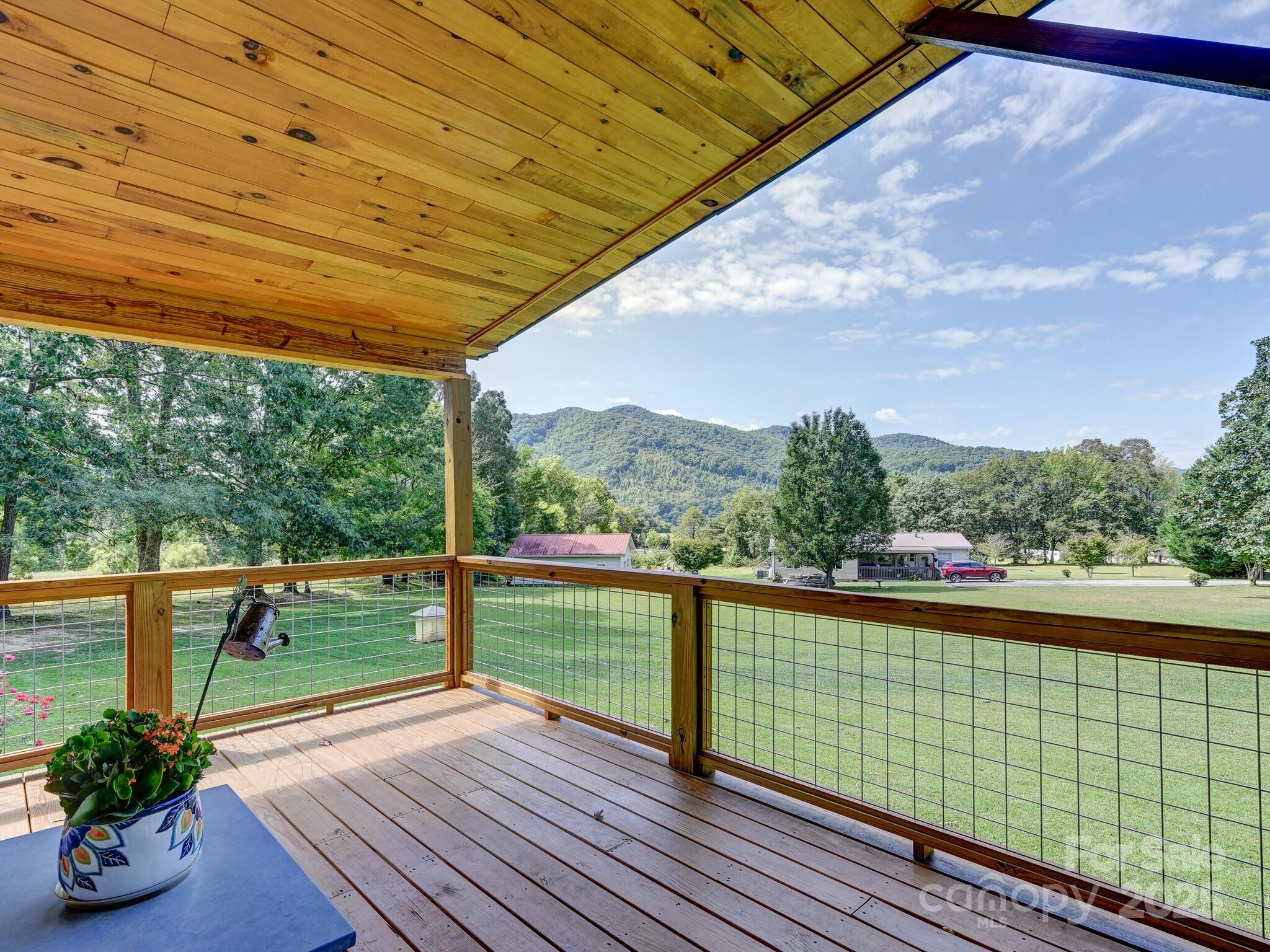 450 Berry Wills Road Hot Springs, NC 28743 - Photo 8 of 48 a view of outdoor space with swimming pool and seating area