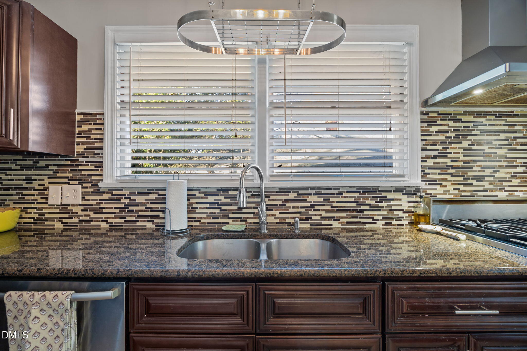 728 East Whitaker Mill Road Raleigh, NC 27608 - Photo 11 of 39 a kitchen with granite countertop a sink and a window