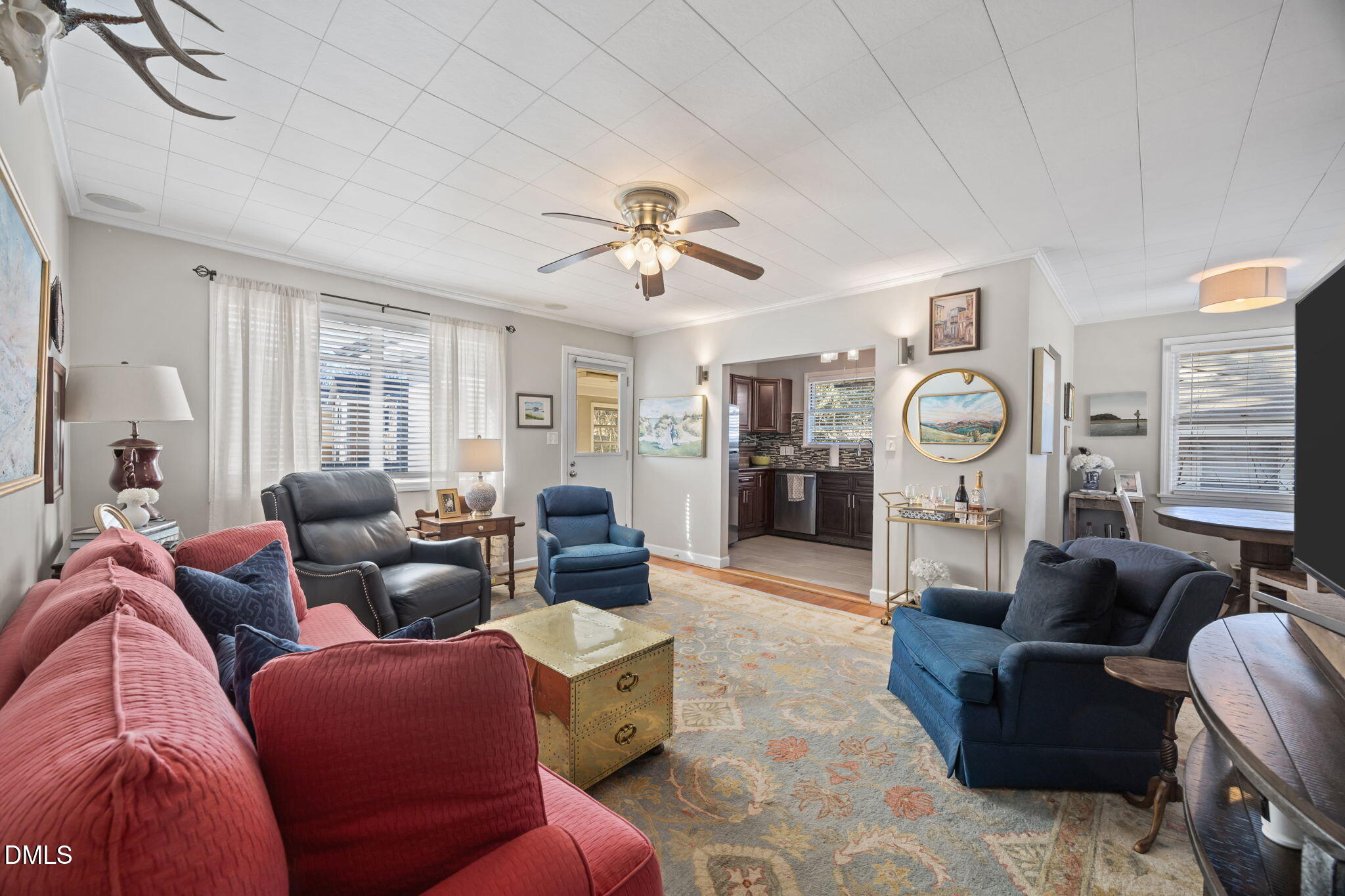728 East Whitaker Mill Road Raleigh, NC 27608 - Photo 14 of 39 a living room with furniture and a large window