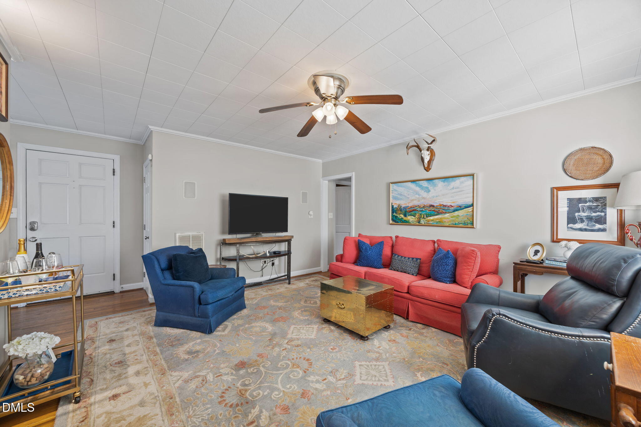 728 East Whitaker Mill Road Raleigh, NC 27608 - Photo 15 of 39 a living room with furniture and a flat screen tv