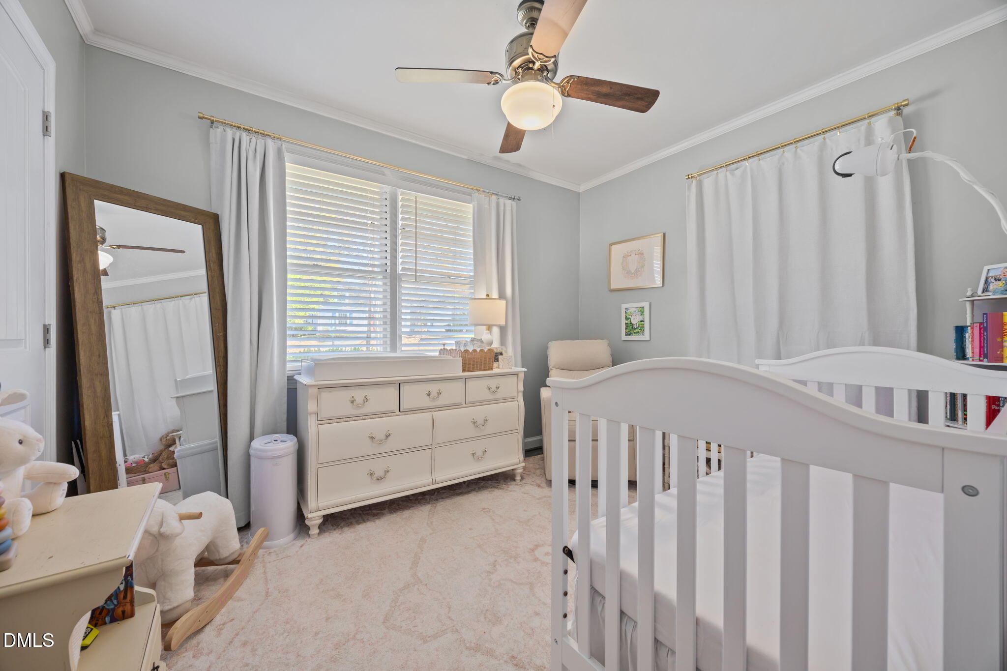 728 East Whitaker Mill Road Raleigh, NC 27608 - Photo 17 of 39 a bedroom with a bed and a window