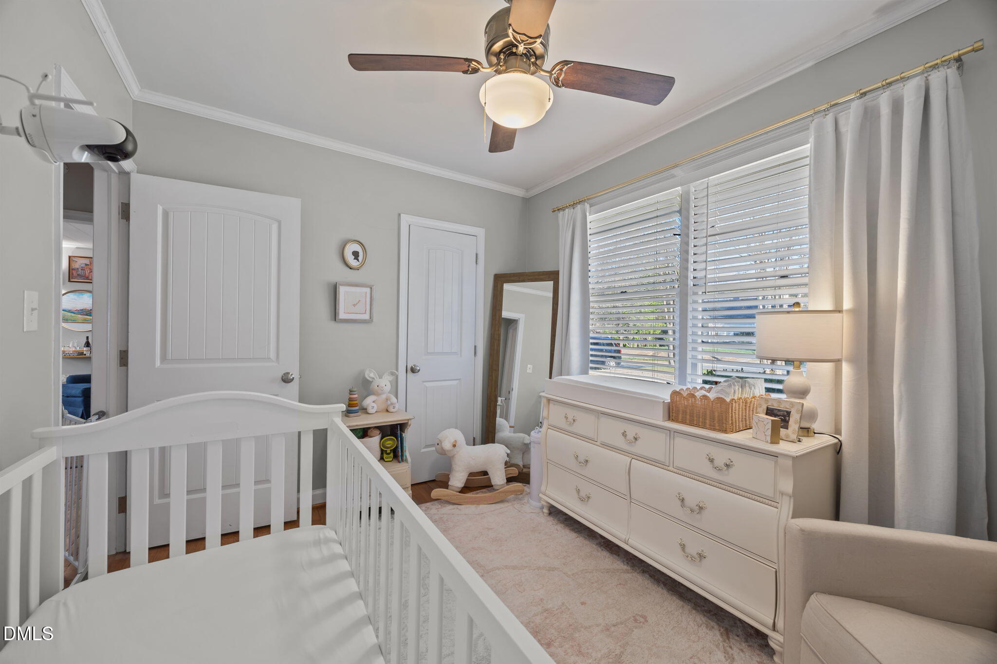 728 East Whitaker Mill Road Raleigh, NC 27608 - Photo 18 of 39 a bedroom with furniture and a window