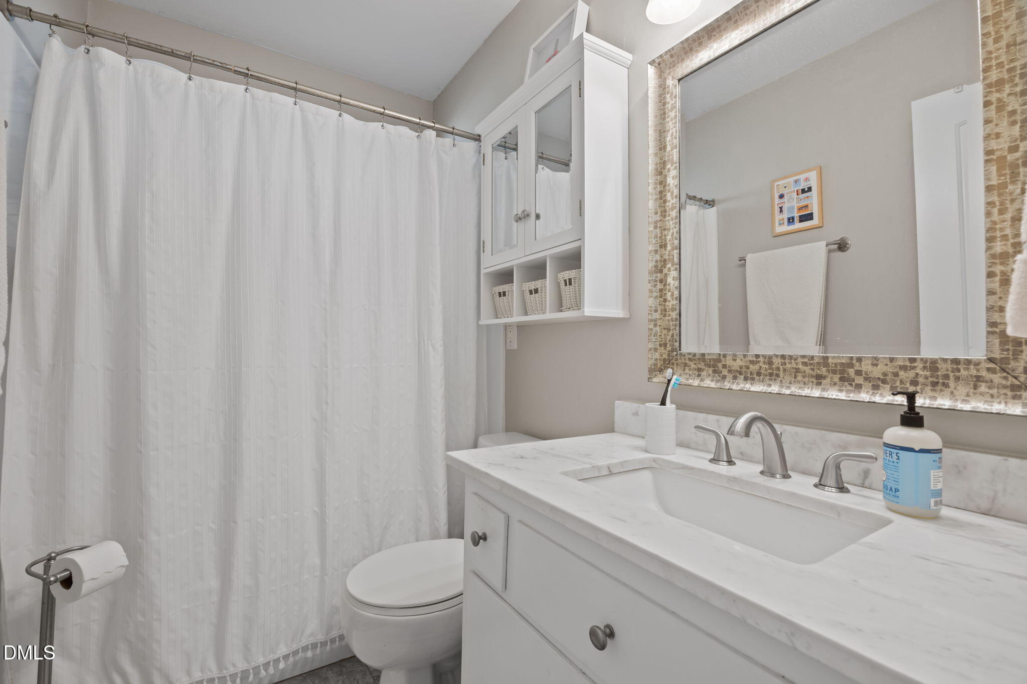 728 East Whitaker Mill Road Raleigh, NC 27608 - Photo 21 of 39 a bathroom with a granite countertop sink and a mirror