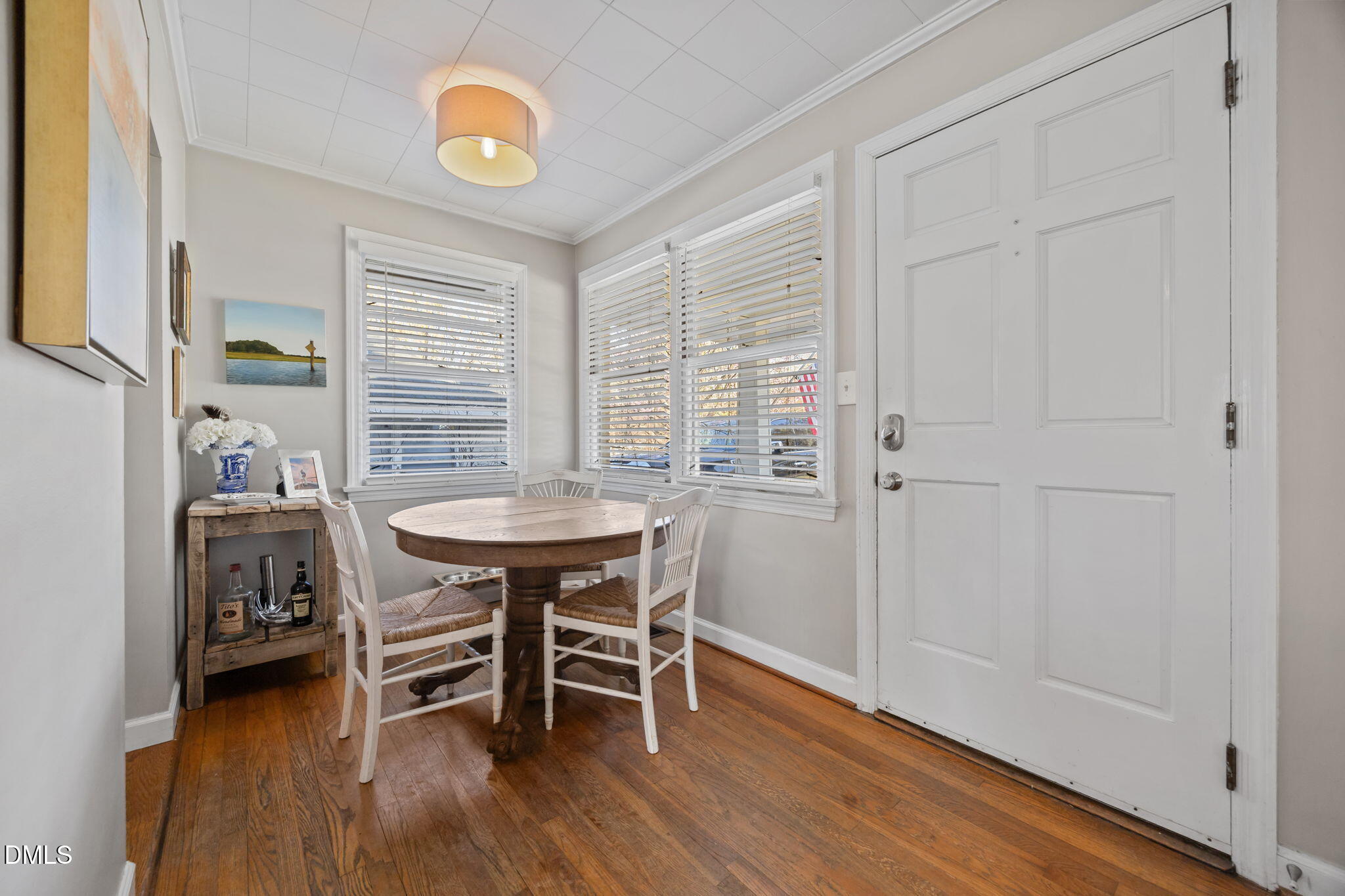 728 East Whitaker Mill Road Raleigh, NC 27608 - Photo 5 of 39 a view of a dining room with furniture and wooden floor